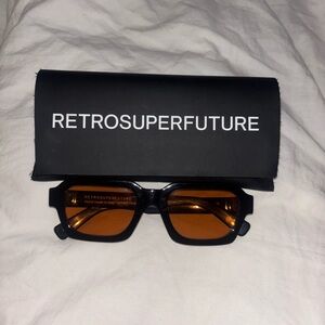RetroSuperFuture Sunglasses with Black Frames and Amber Lenses